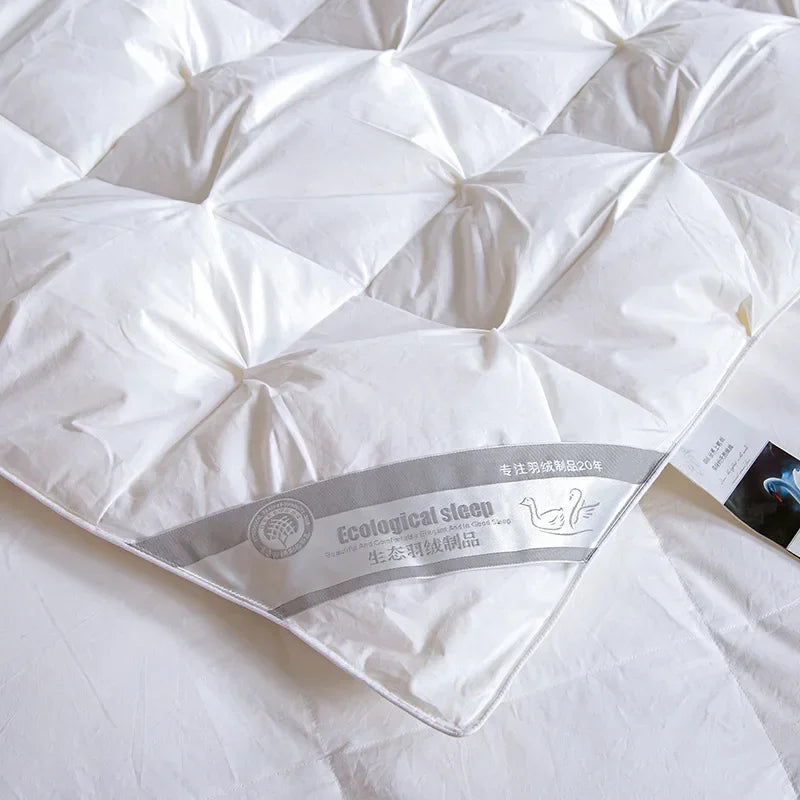 White goose down quilt with diamond-stitched pattern and ecological sleep label for temperature controlled warmth