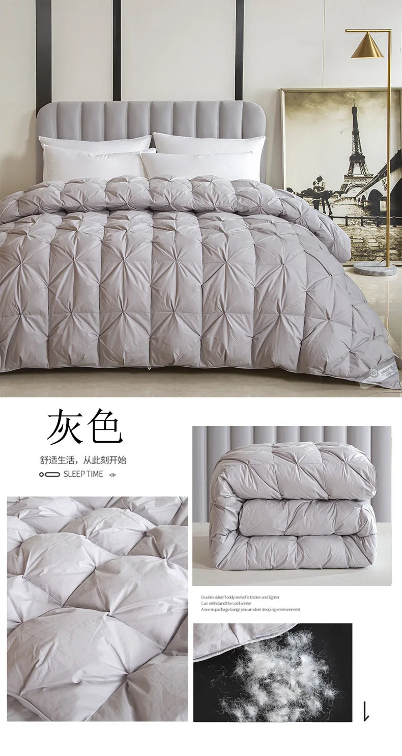 Gray quilted comforter with plush texture and subtle stitching featuring temperature controlled white goose down filling