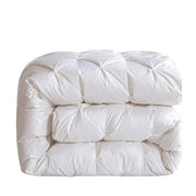 White goose down quilt with white quilted comforter featuring plush texture and diamond-shaped stitching for warmth