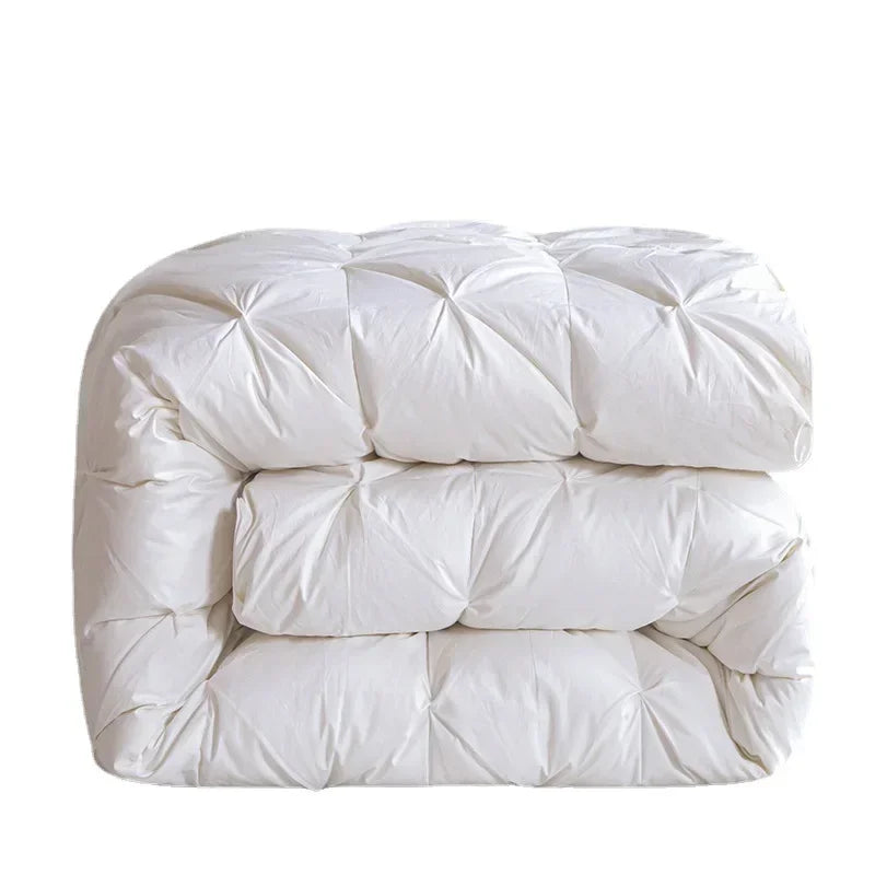 White goose down quilt with white quilted comforter featuring plush texture and diamond-shaped stitching for warmth