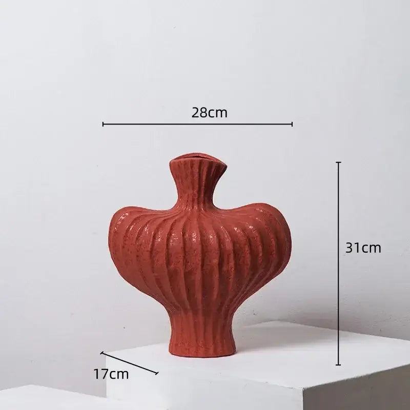 A terracotta fringe heterophore vase with ribbed organic shape and flared neck for living room ceramic decorbites decor