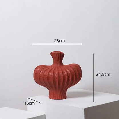 A terracotta-colored ceramic fringe heterophore vase with a ribbed bulbous body and narrow neck for living room decor