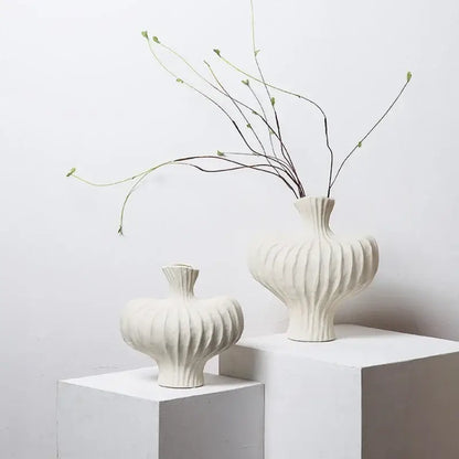 White ceramic fringe heterophore vases with vertical ribbed texture and slender necks for living room decorbites fringe heterophore decor
