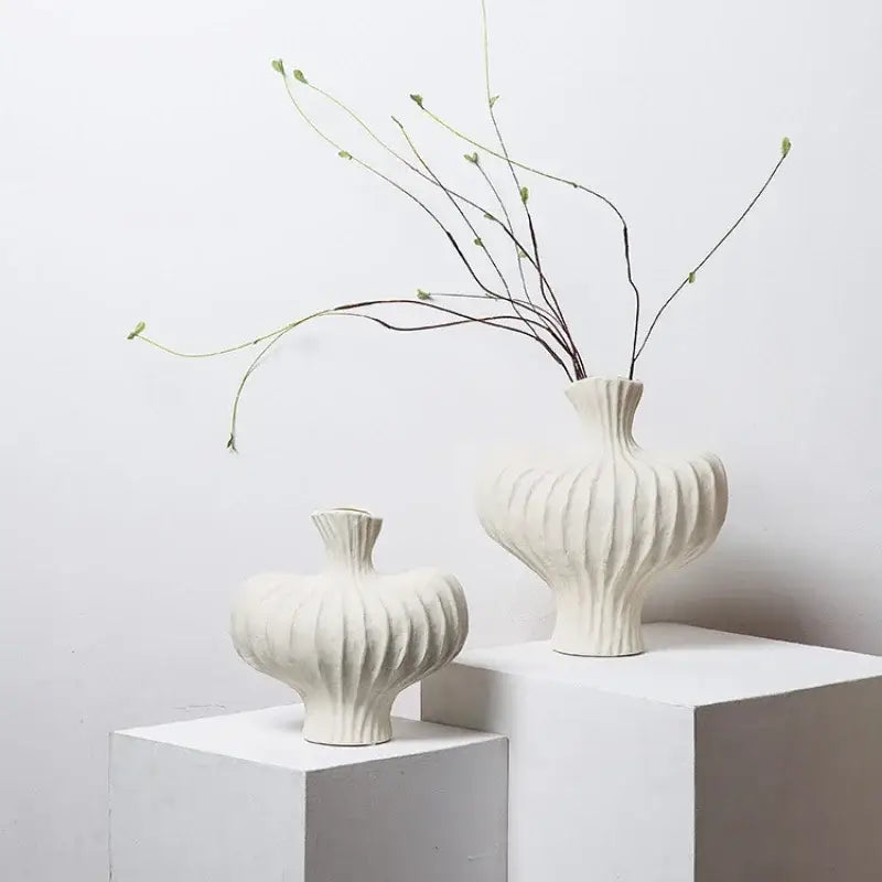 White ceramic fringe heterophore vases with vertical ribbed texture and slender necks for living room decorbites fringe heterophore decor