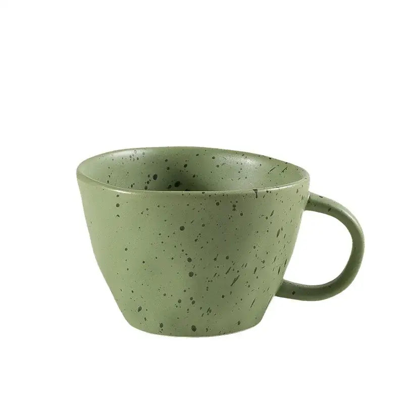 A matte sage green speckled ceramic mug with a rounded handle from the decorbites creative ceramic espresso cup set