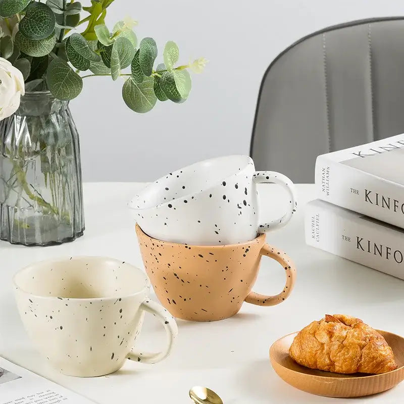 Set of three terracotta speckled creative ceramic espresso cups in beige, peach, and white for cup set decorbites creative ceramic