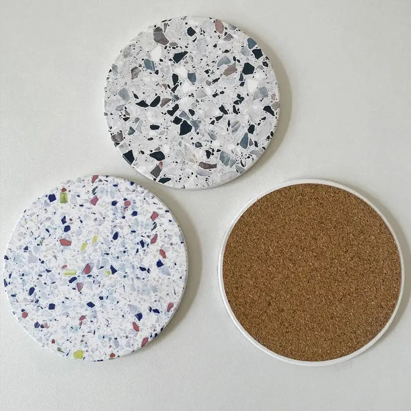 Set of 4 terrazzo pattern decorbites diatomite coasters with white base and multicolor stone fragments for dining room use