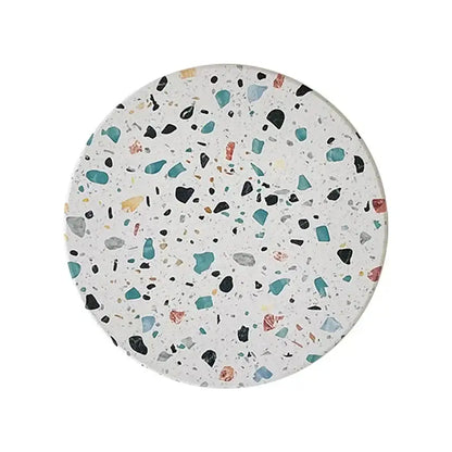 Circular terrazzo decorbites diatomite coaster with white base and teal black gray yellow muted pink specks for dining mugs