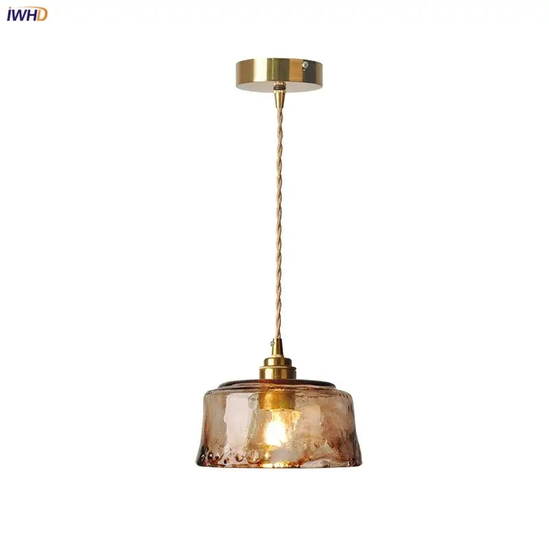 Textured amber glass pendant light with hand-blown finish and brass hardware for dining room decorbites amber glass