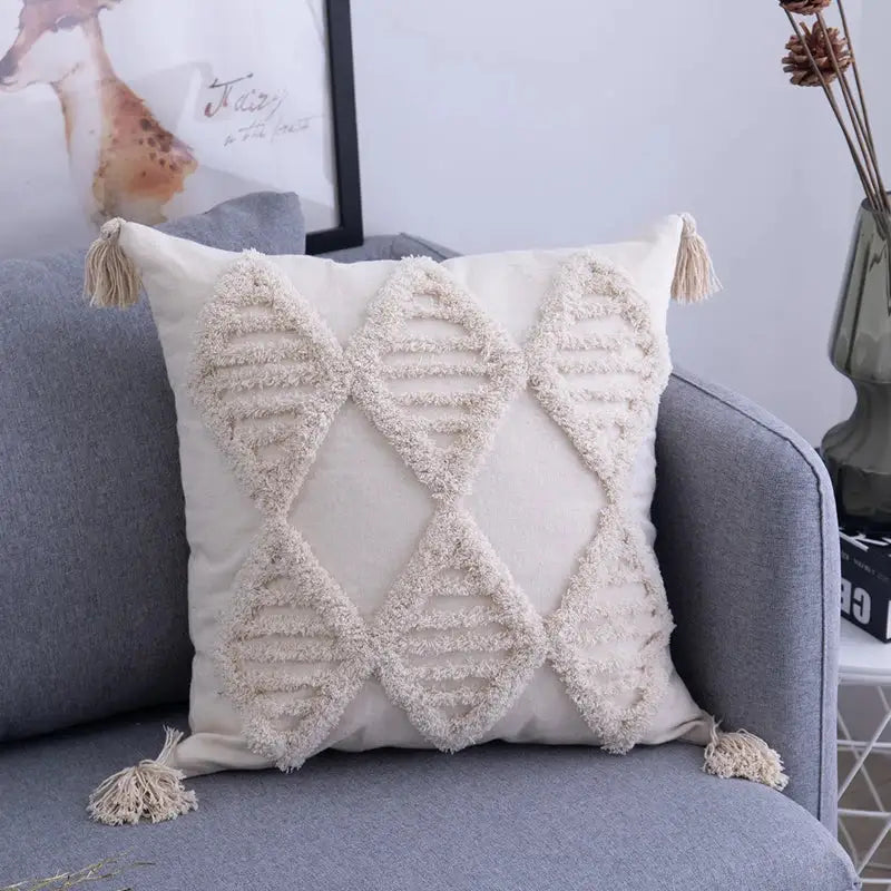 Cream-colored cushion cover with textured diamond patterns and matching decorbites beige tassels for living room decor