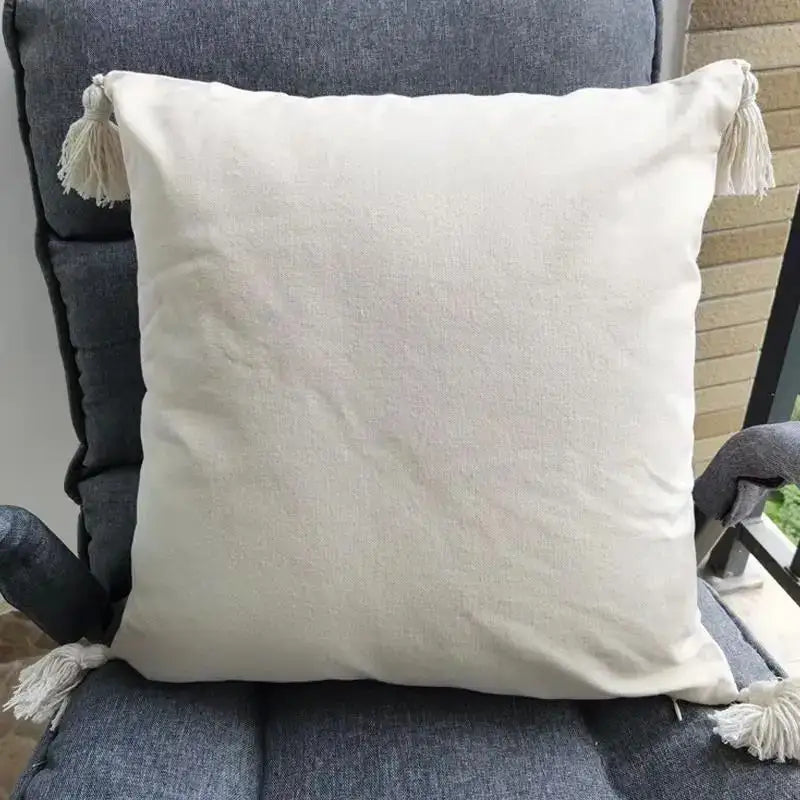 Cream-colored linen cushion cover with matching beige tassels perfect for decorbites beige tassels living room decor
