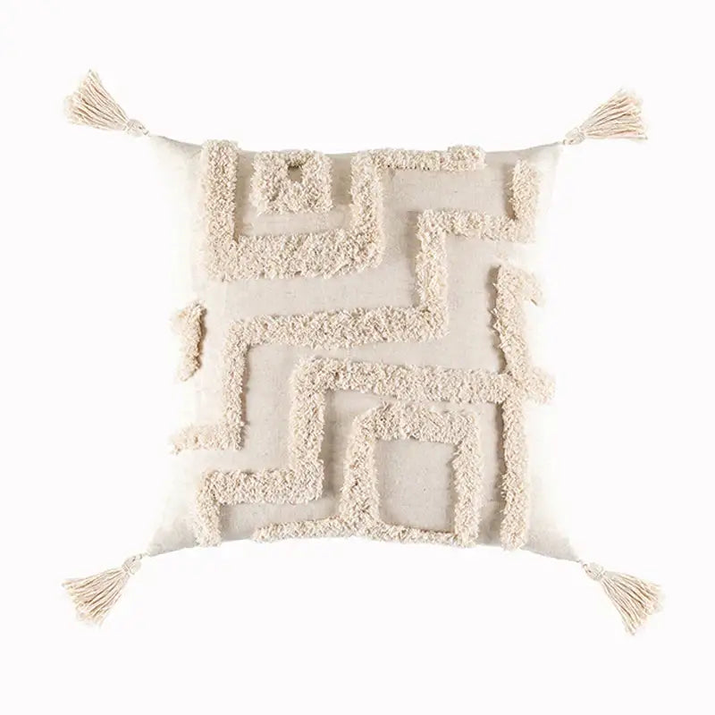 Cream-colored cushion cover with a textured maze-like pattern and decorbites beige tassels for living room decor