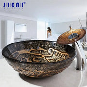 Textured black and gold glass wash basin set with matching waterfall faucet for modern bathroom use