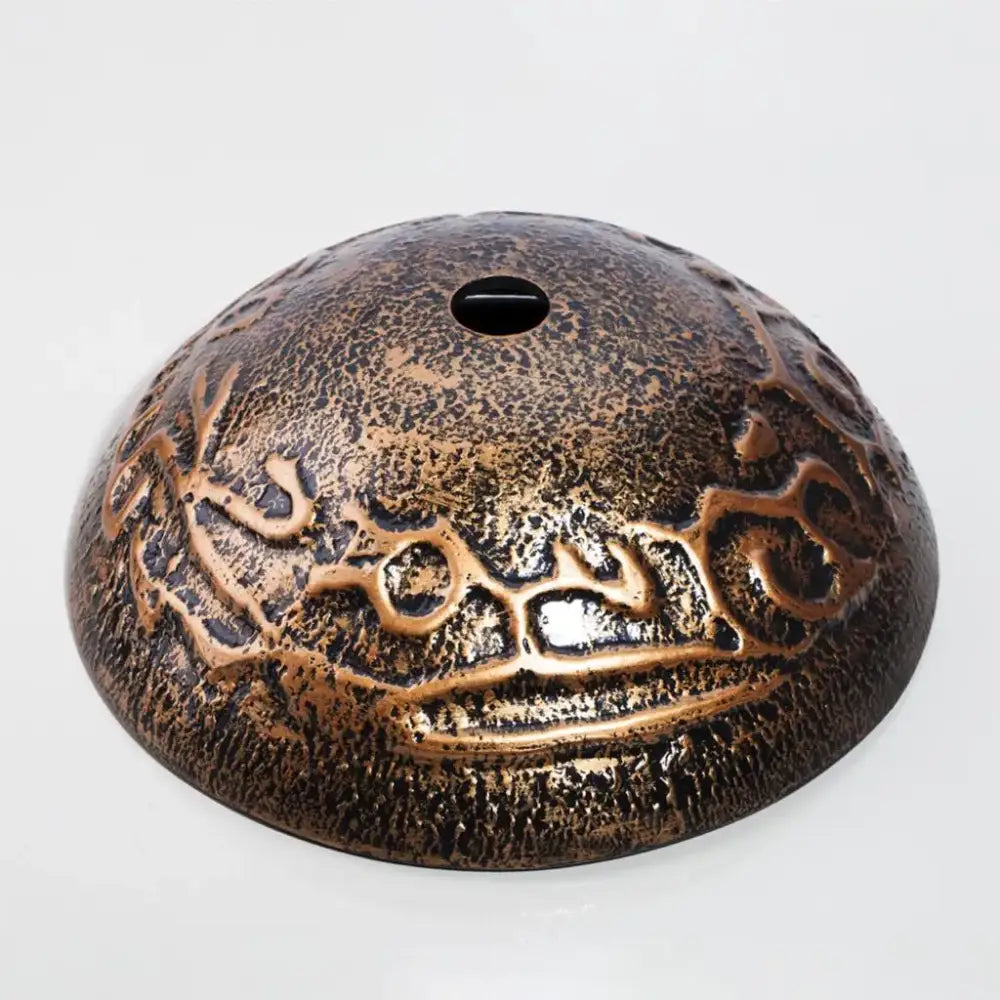 Bronze textured dome incense burner with intricate arabic script detail complements black and gold glass wash basin set