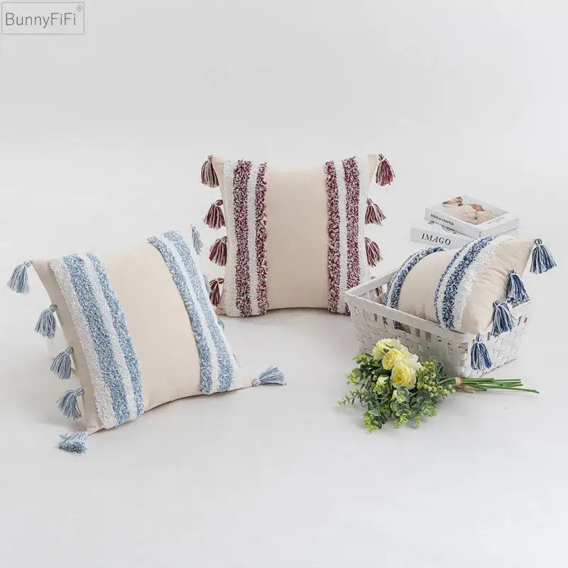 Cream-colored cushion cover with textured blue and maroon stripes and tassels for home decor by decorbites blue grey