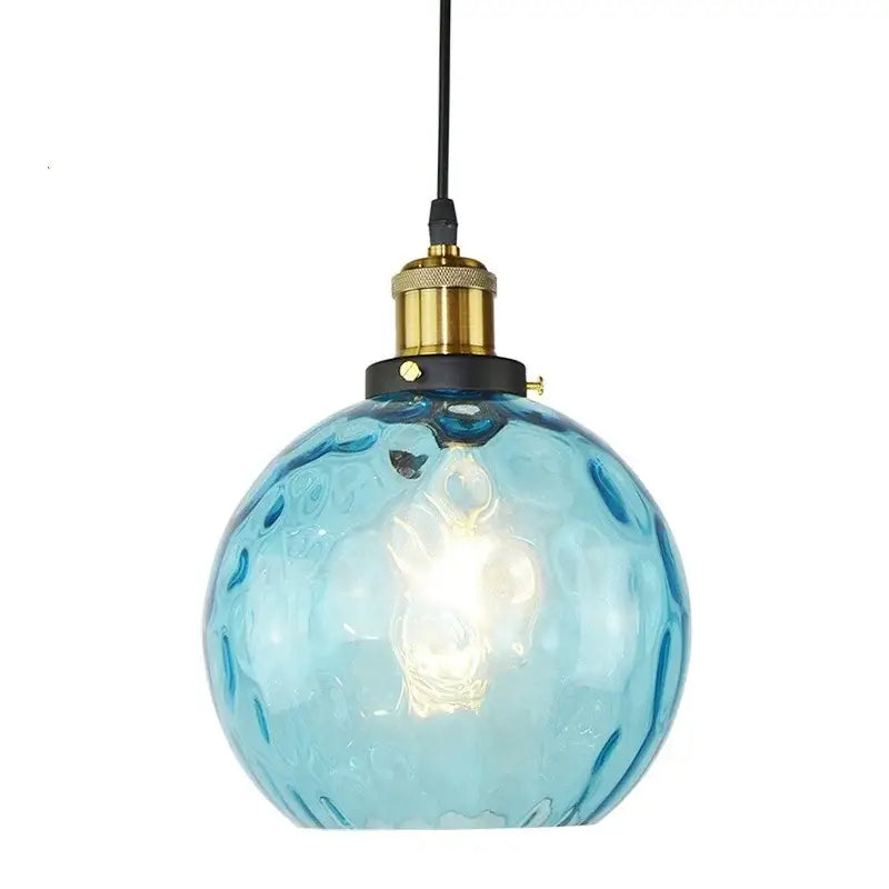 Textured blue glass ball pendant light with brass socket and black cord for dining room decorbites blue glass design