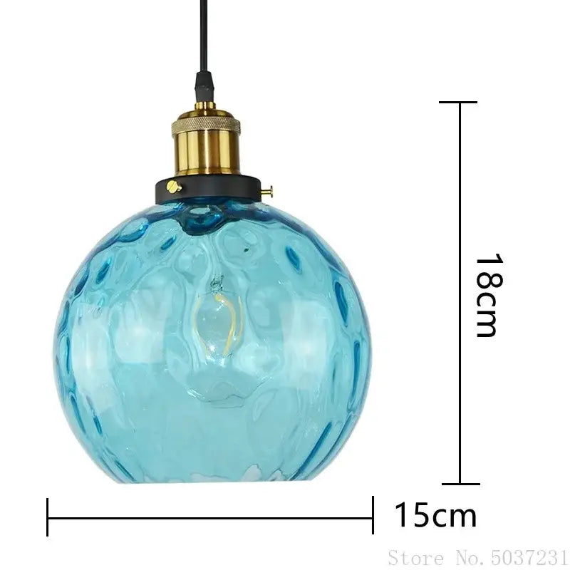 Textured blue glass ball pendant light with bubble surface and brass socket for dining room decorbites blue glass