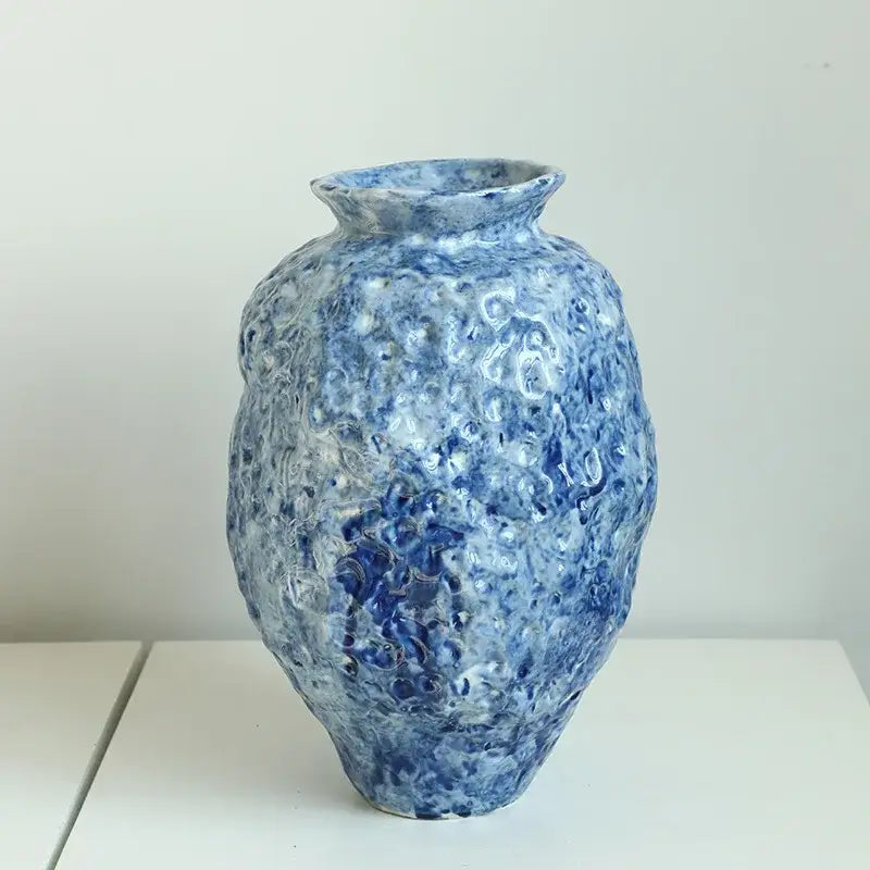 Textured blue and white ceramic vase with bulbous body and flared rim for ceramic vase hydroponic decorbites blue ceramic use