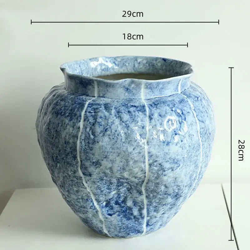 A textured blue ceramic vase with white pumpkin-like surface and crackle lines for ceramic vase hydroponic decorbites