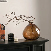 Textured brown glass vase with rounded body and narrow neck holding twisted branches for decorbites brown glass hydroponics