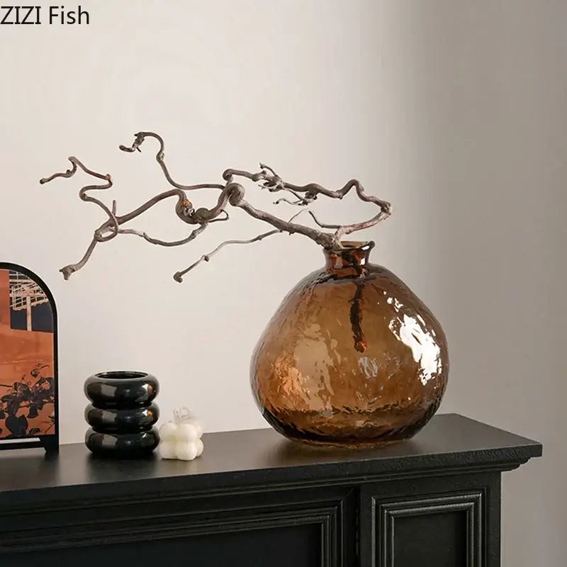 Textured brown glass vase with rounded body and narrow neck holding twisted branches for decorbites brown glass hydroponics