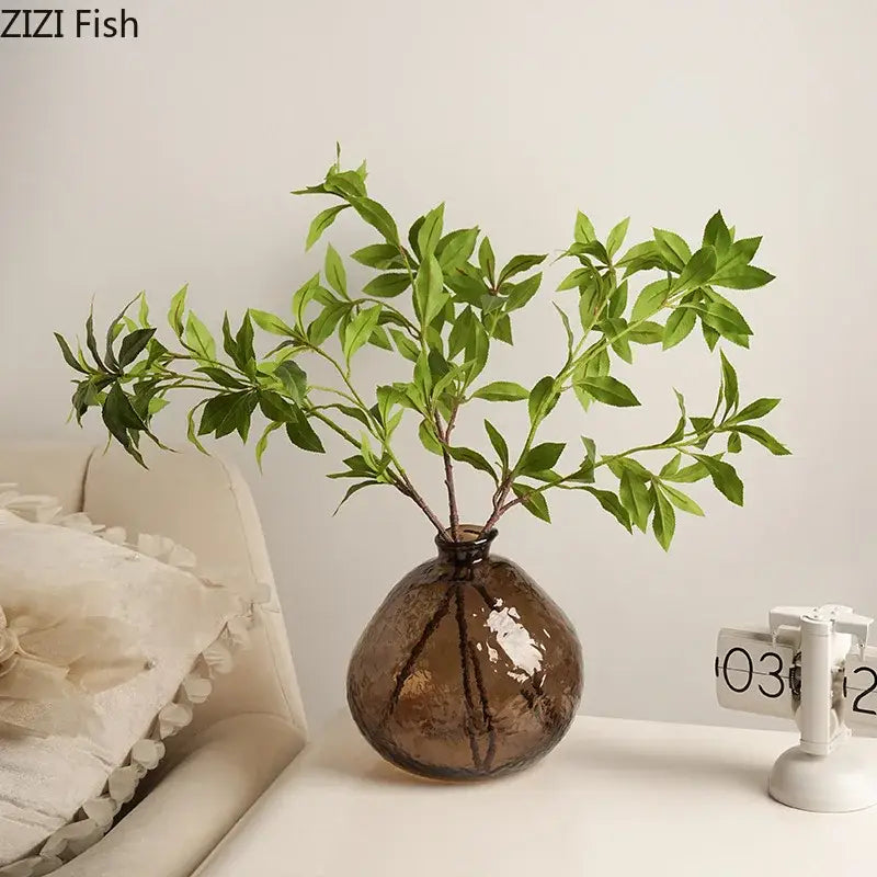 A brown glass vase hydroponics plant pot with textured design holding artificial green foliage for living room decorbites brown glass