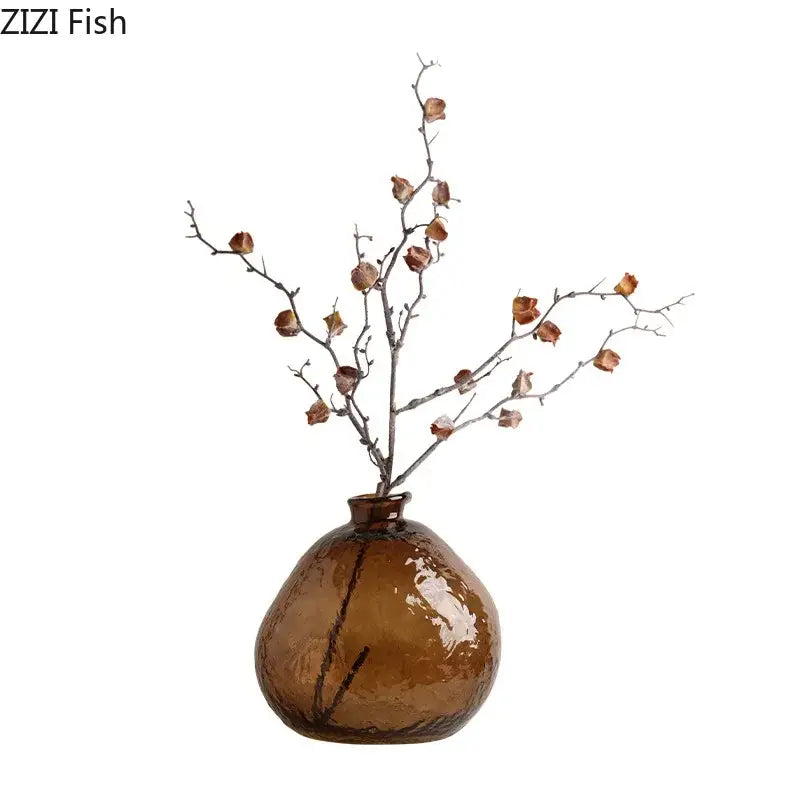 Textured brown glass vase with rounded body and narrow neck holding dried branches for living room decorbites brown glass