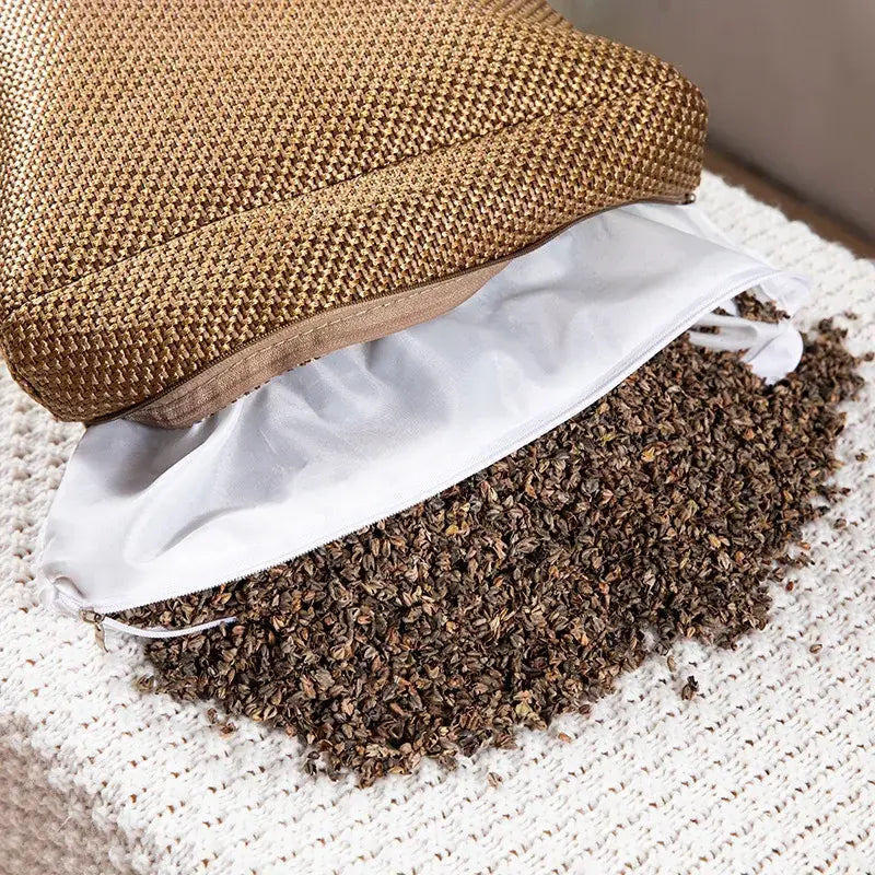 A decorbites cooling cervical pillow in textured brown woven straw filled with dark brown dried lavender buds for sleep health