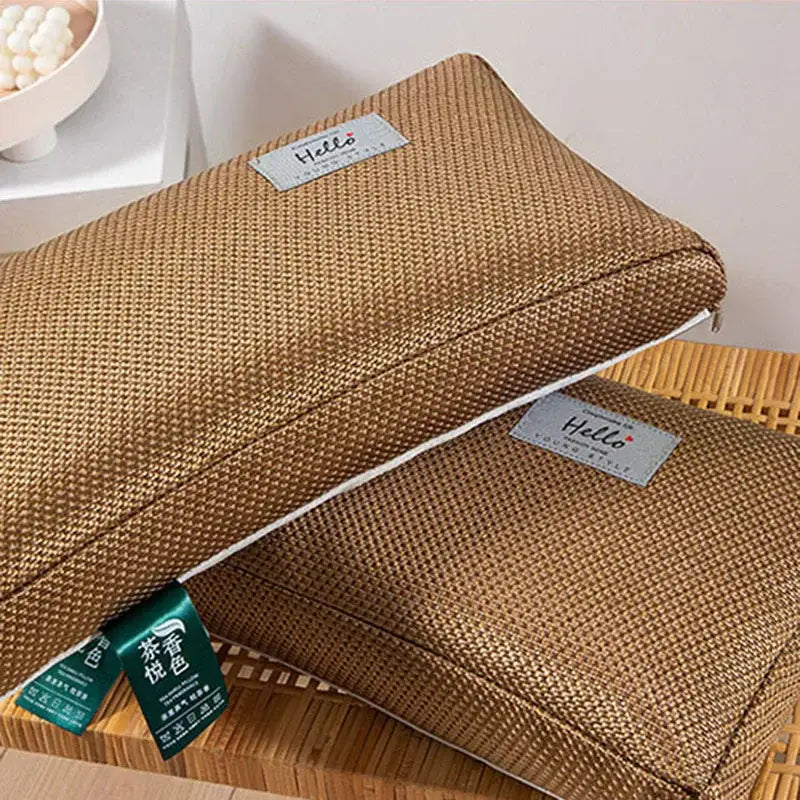 Tan woven fabric pencil case with subtle texture and white zipper trim paired with decorbites cooling cervical pillow