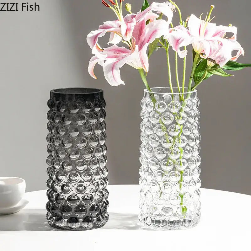 Clear glass hydroponics plant pots with textured raised circular bubbles and a black gradient version for living room tables