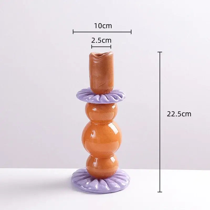 Glossy orange and lavender ceramic candlestick holder with tiered bulbous design for decorbites geometric glass decor