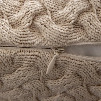 Cream-colored cable knit cotton pillow cover with matching zipper closure from decorbites cable knit set for living room decor