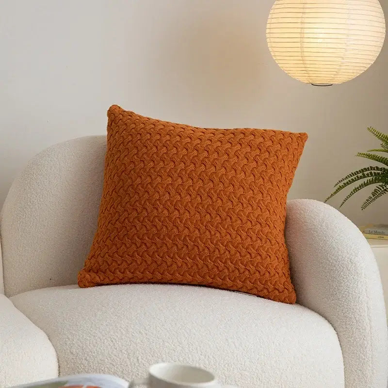 Warm orange pillow cover with textured woven cable knit cotton pattern perfect for decorbites cable knit decor