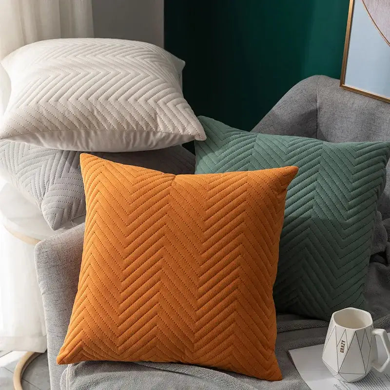 Orange chevron-quilted cushion cover with soft plush fabric complements decorbites blue wave living room decor