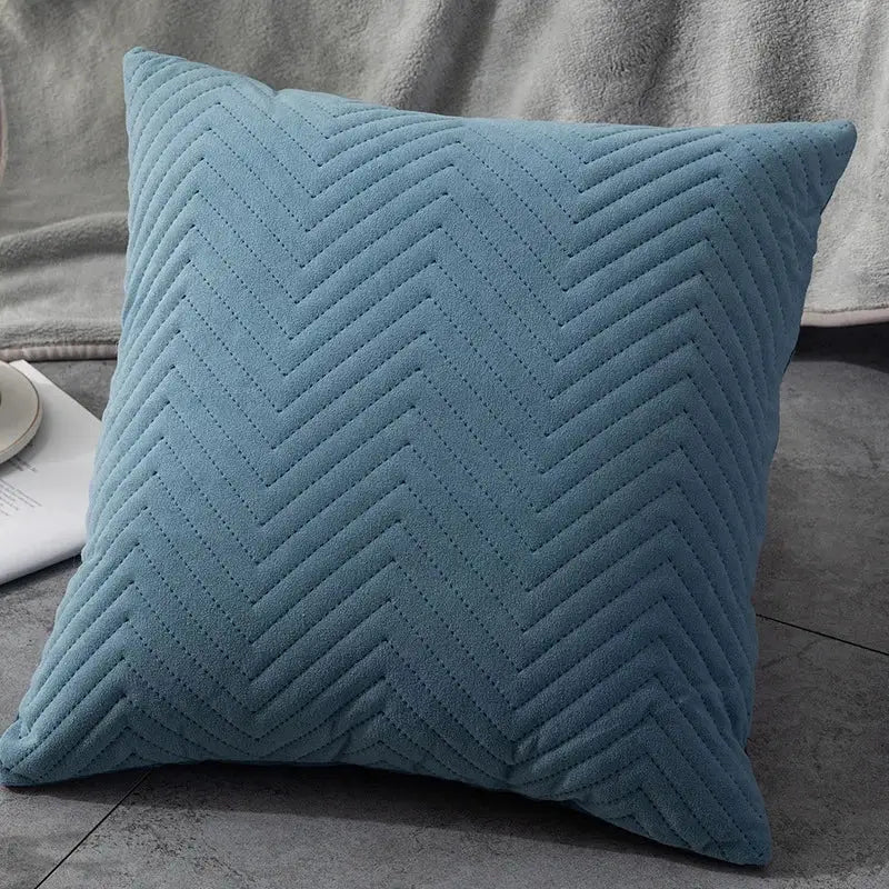 A soft teal cushion cover with textured chevron quilting perfect for decorbites blue wave crimping living room decor