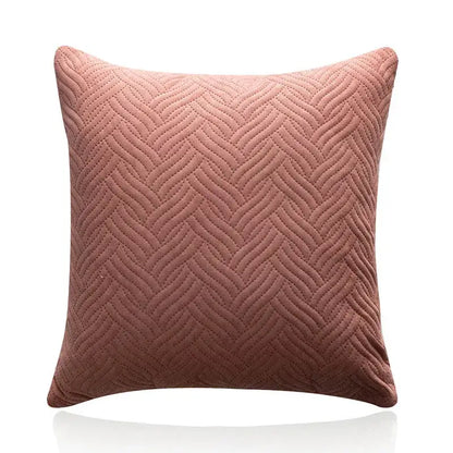 A soft dusty rose cushion cover with a textured herringbone quilted pattern for decorbites blue wave living room decor