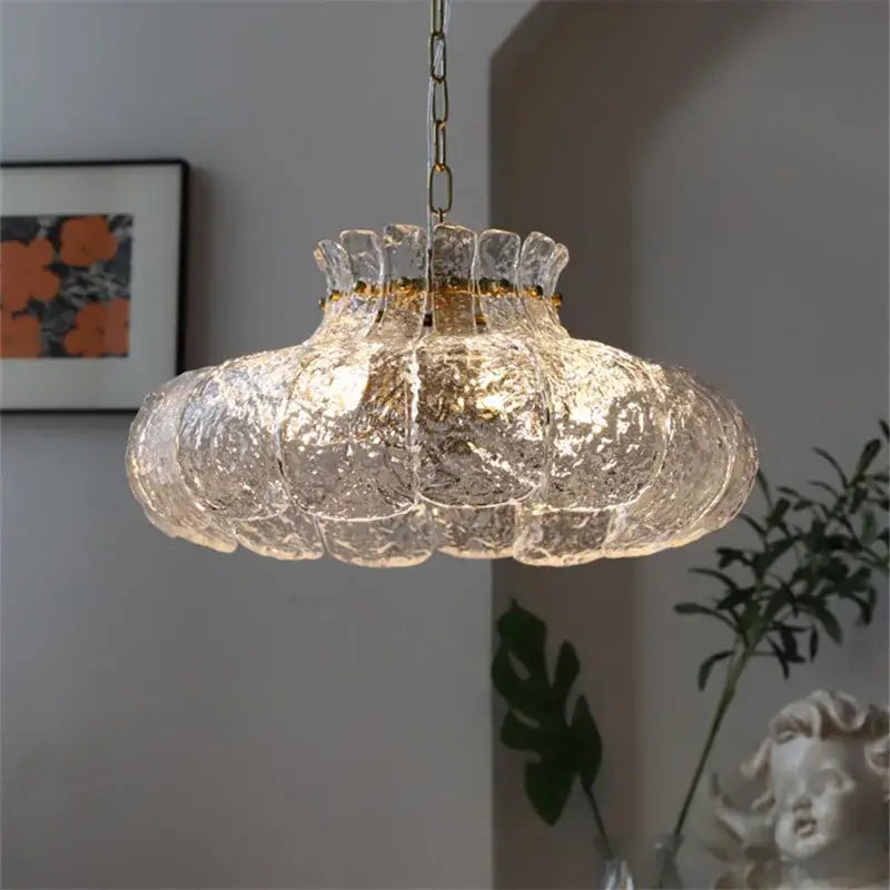 Textured clear glass french pendant chandelier with gold-toned metal chain and rim for dining room lighting