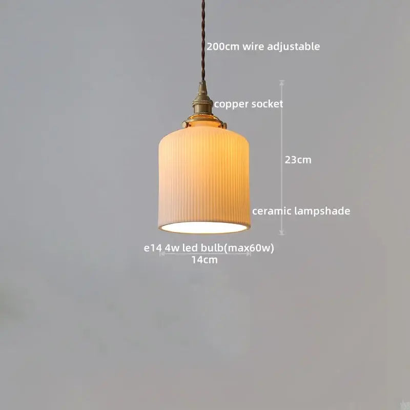 A warm-toned ceramic pendant light with vertical ridges and copper socket complements decorbites clear glass led fixtures