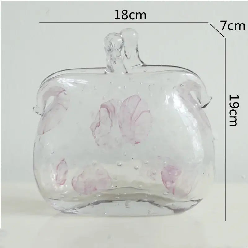 Textured clear glass vase with pink floral patterns and leather handles for living room decorbites clear glass use
