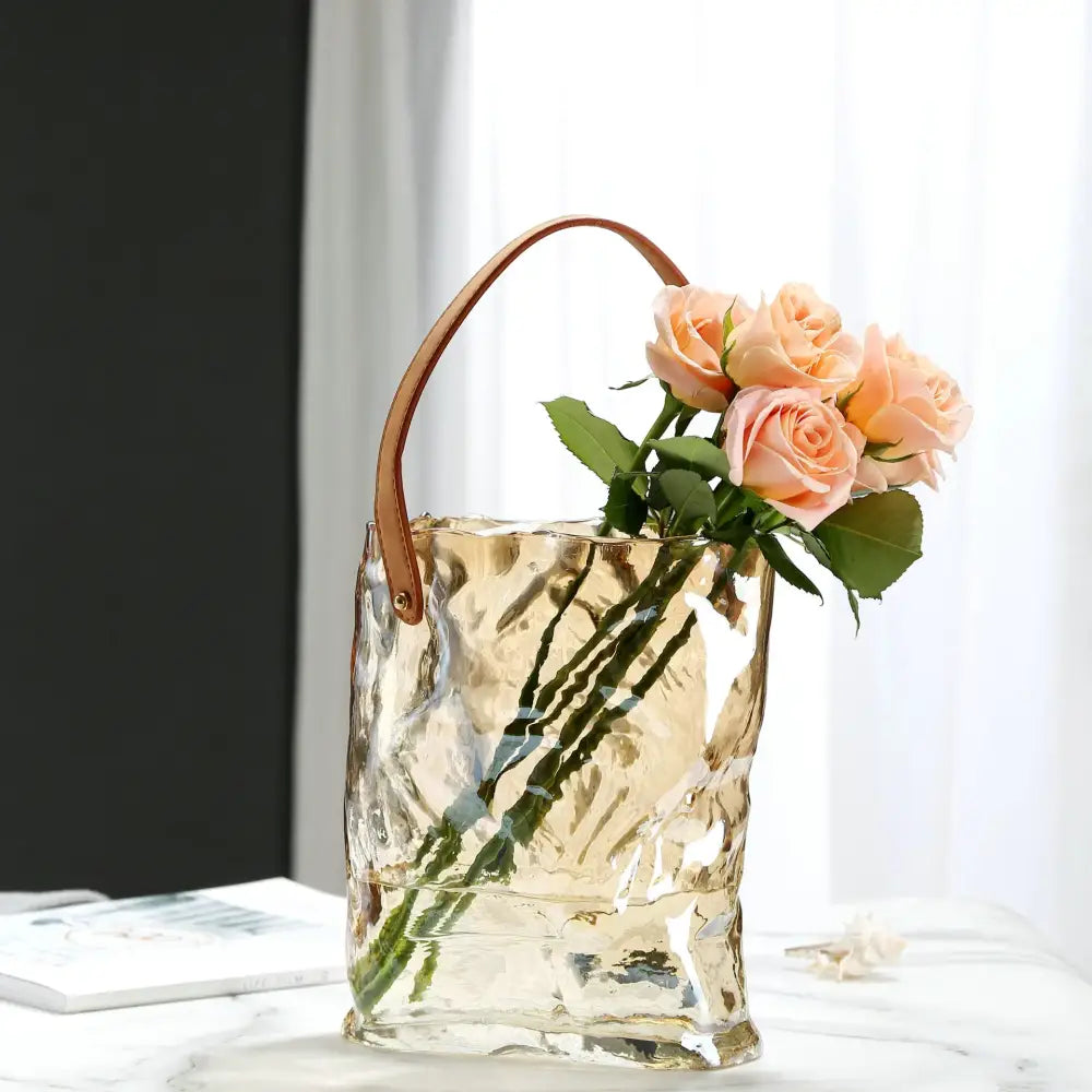 Textured clear glass vase with brown leather handles holding peach roses for decorbites clear glass hydroponic decor