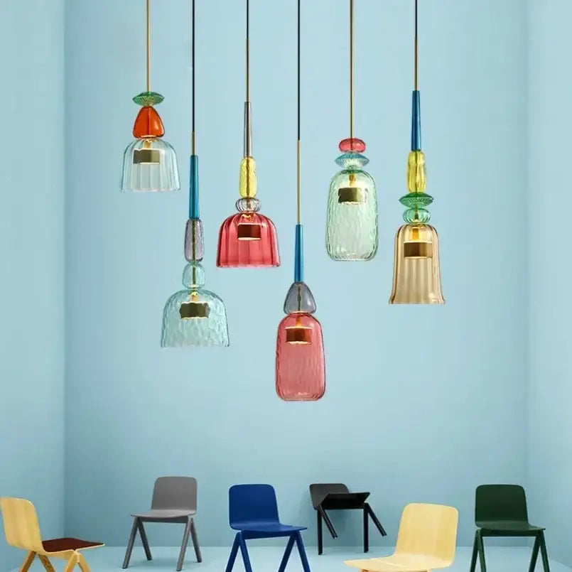 A collection of colorful textured and smooth glass pendant lights in red green blue yellow and amber for kitchen dining room chandelier