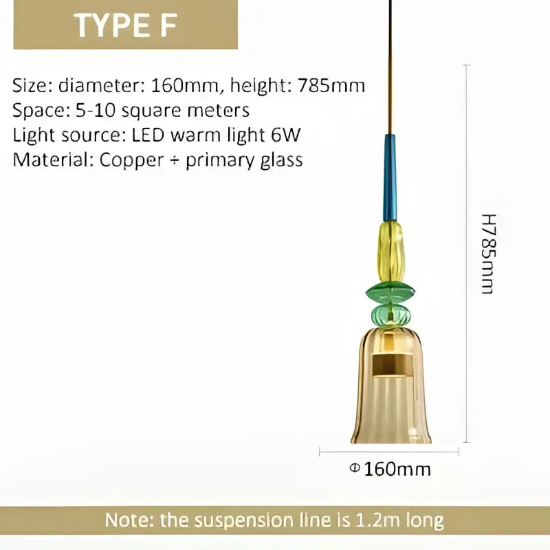 A hanging pendant light with copper frame and layered translucent green and amber glass pendant lights for kitchen use