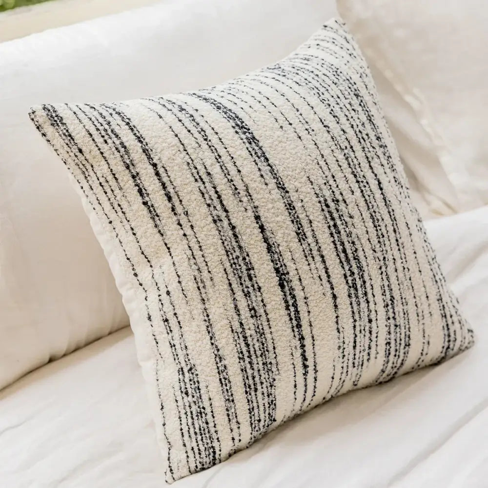 A cozy cream and black striped comfort woolen pillow cover by decorbites for living room decor