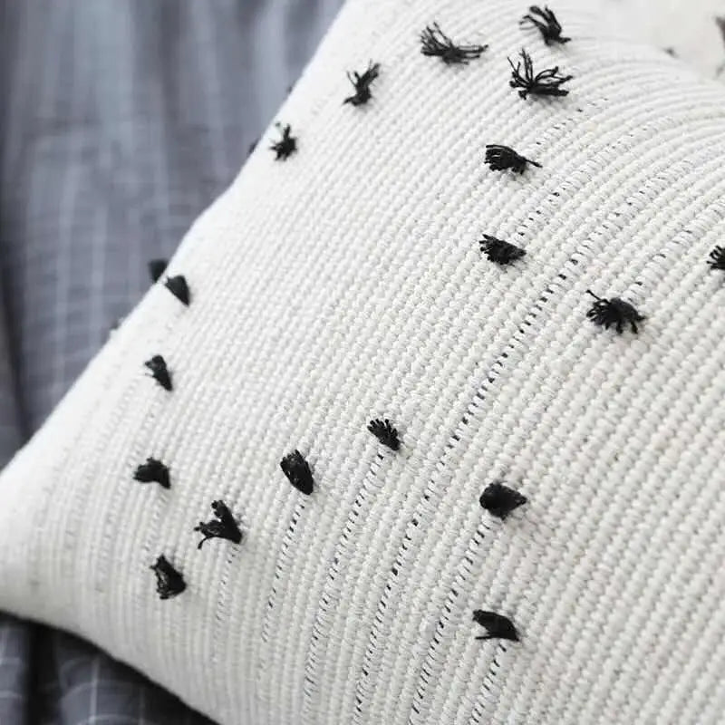 Textured cream cushion cover with black embroidered geometric tassels for living room decorbites geometric tassels