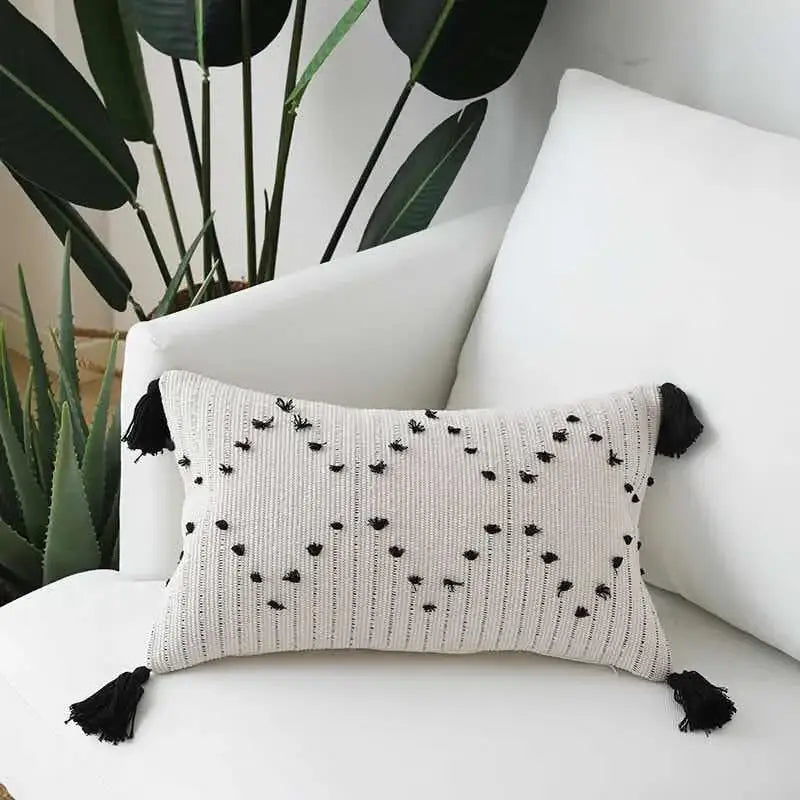 Beige cushion cover with black embroidered dots and tassels featuring decorbites geometric tassels design for living room decor