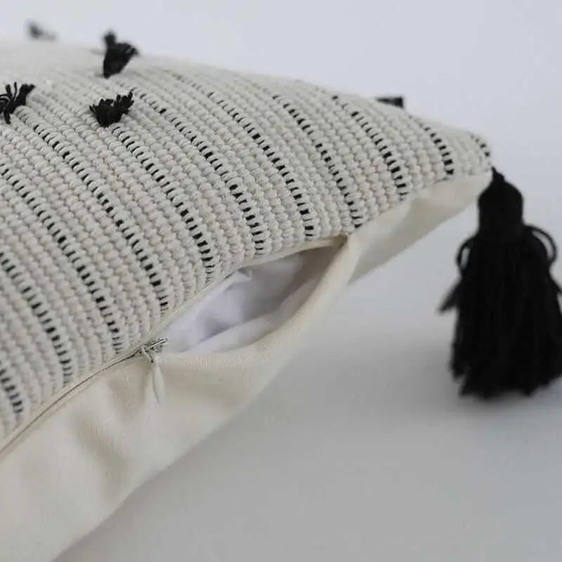 Off-white woven cushion cover with black geometric tassels and striped pattern for living room decorbites geometric tassels