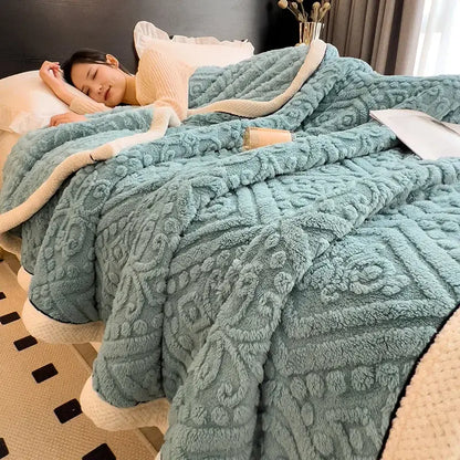 A teal coral fleece warm blanket with raised geometric texture and cream inner lining for cozy decorbites use
