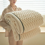 Cream coral fleece warm blanket with textured diamond pattern and black trim ideal for cozy bedroom decorbites use