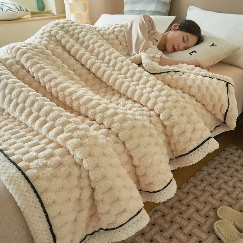 Cream-colored warm blanket with textured coral fleece knit pattern and black trim by decorbites for cozy bedroom use