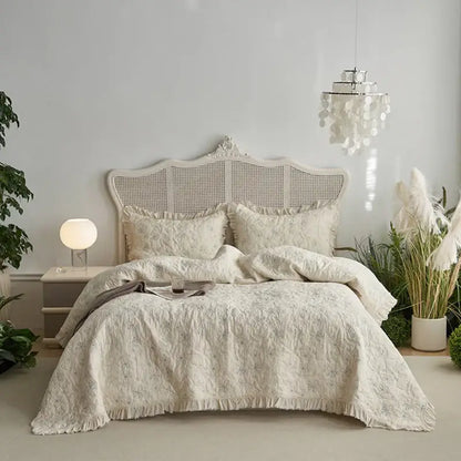 Cream-colored decorbites cotton quilted bedspread set with floral embroidery and soft fringed hem for bedroom decor
